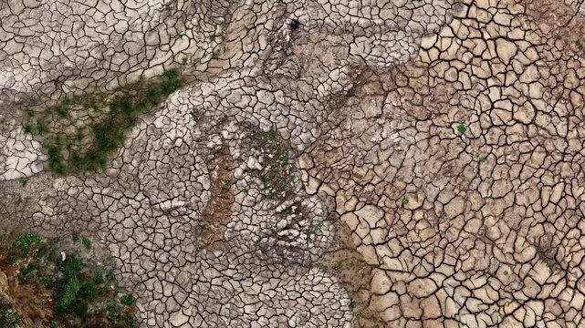 Aerial view of the cracked, parched earth at the Tagebau Hambach open-pit mine in Elsdorf, Nordrhein-Westfalen, Germany.
