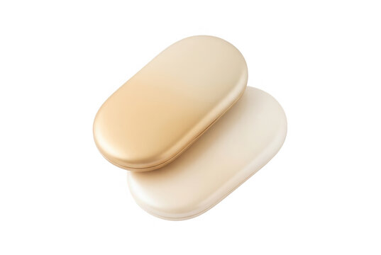 Duas c&aacute;psulas de suplemento em formato oval com acabamento met&aacute;lico dourado e creme, isoladas em um fundo branco limpo, ideais para conceitos de sa&uacute;de, beleza e bem-estar.