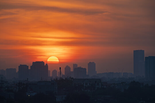 Dramatic Orange Sunset Over Hanoi Skyline, Vietnam