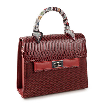 Elegant Red Luxury Handbag with Snakeskin Texture and Silk Scarf Wrap. premium red fashion handbag  isolated on white background.