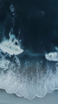 Vertical Aerial View of Powerful Ocean Waves Crashing on a Dark Beach Generative AI