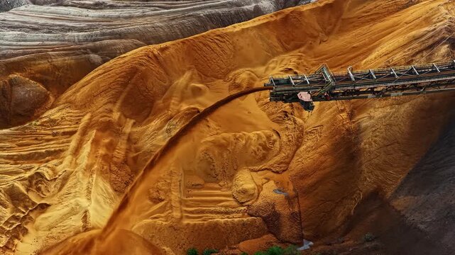 Aerial view of the massive bucket-wheel excavator operating at Tagebau Hambach, moving earth in the open-pit mine in Elsdorf, Nordrhein-Westfalen, Germany.