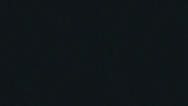 Dark textured background with subtle grainy pattern