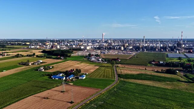 Aerial view of ORLEN Plock Production Plant surrounded by agricultural fields and rural landscape in Plock, Mazowieckie Voivodeship, Poland.