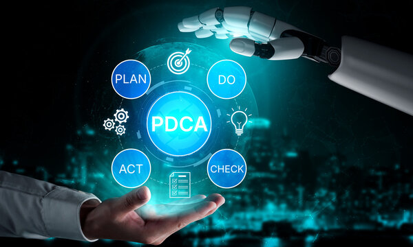 Robotic Hand Reaching Out to Human Hand with PDCA Cycle Elements in a Futuristic Setting Representing Continuous Improvement and Automation Concepts. Bitwise.