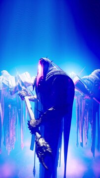Gothic Blue Concert Visual of Three Shadow Knights Hovering with Weapons