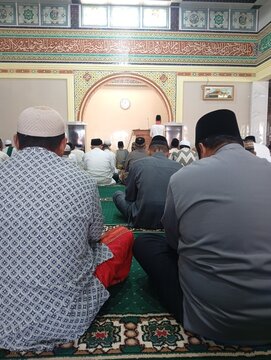 Muslim Men Listening to Friday Sermon Inside Mosque