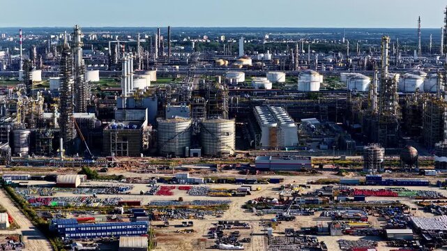 Aerial view of the Orlen Plock Production Plant featuring industrial infrastructure, storage tanks, and distillation towers in Plock, Masovian Voivodeship, Poland.