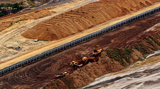 Aerial view of Tagebau Hambach open-pit mine with large excavators and conveyor belts in Elsdorf, Nordrhein-Westfalen, Germany.