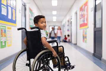 Obraz premium Young Boy in Wheelchair in Elementary School Hallway for Inclusive Education Concept
