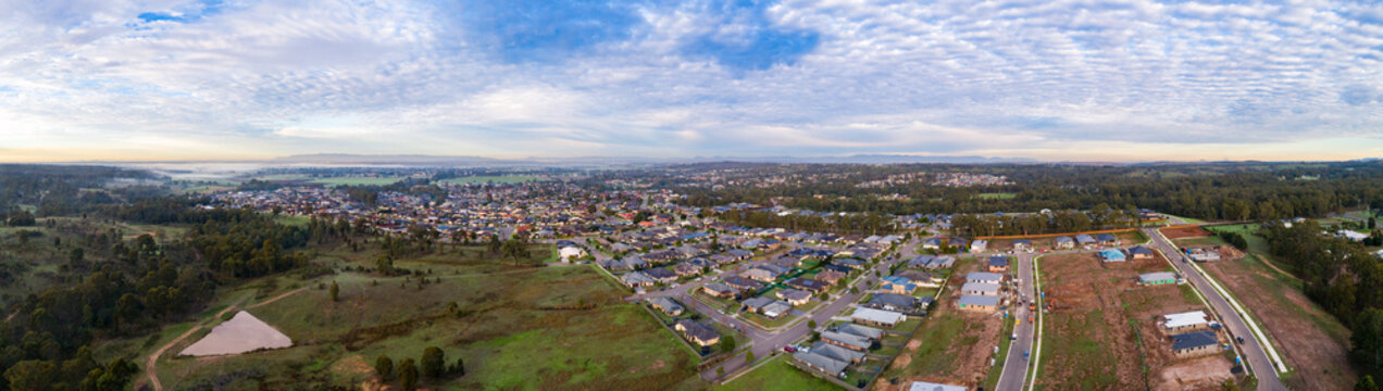 New houses under construction in suburb at edge of town in Hunter Valley Australia