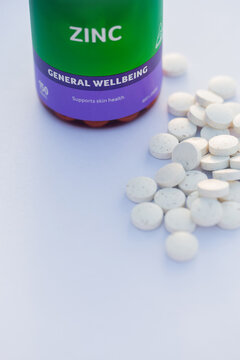 Zinc supplements in tablet form for general wellbeing on white