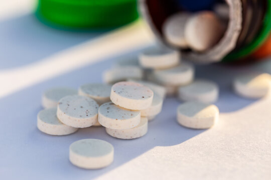 Zinc supplements in tablet form for general wellbeing on white