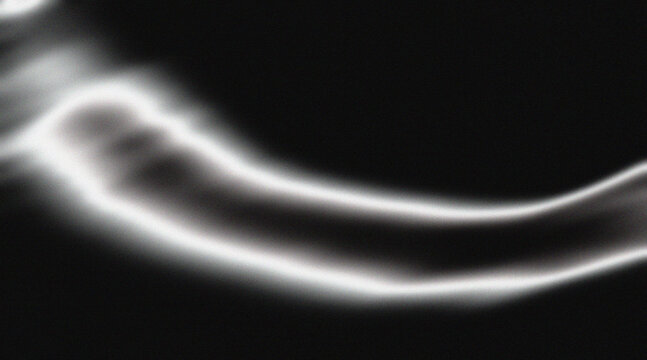 Monochrome abstract dak metallic wave background with grainy noise.