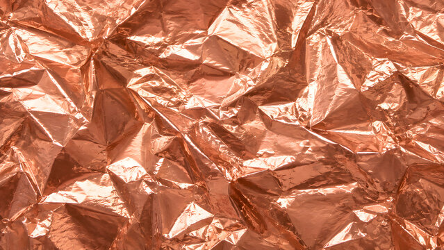 Crumpled metallic copper foil texture with reflective surface