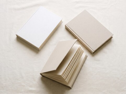 Blank Hardcover Books and Notebook Mockup on Linen Fabric