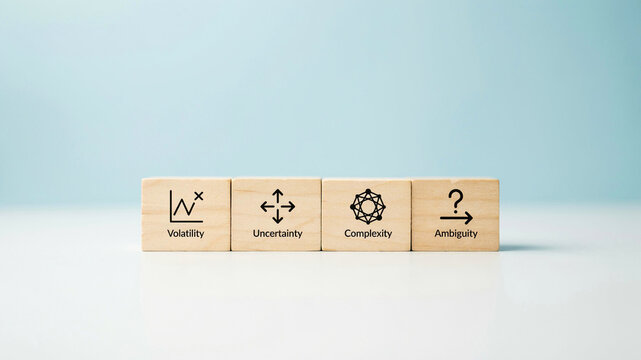 Wooden Blocks Displaying VUCA Model Concepts of Volatility Uncertainty Complexity and Ambiguity for Business Strategy