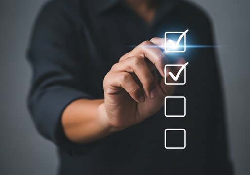 Person in a dark shirt marking check boxes on a digital checklist with a glowing light effect