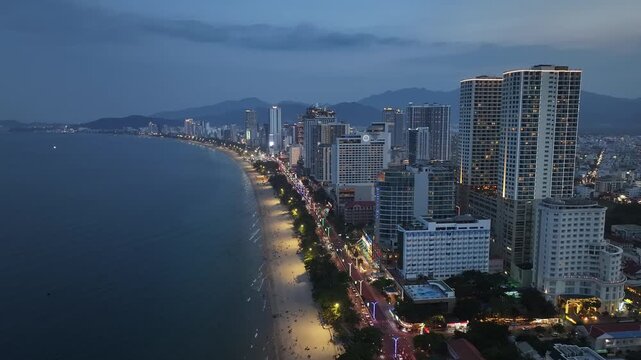 Aerial view of Nha Trang city skyline, beach scenery, and night view in Vietnam