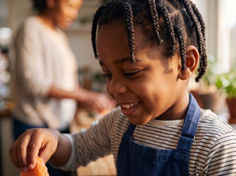 Young African American Boy Making Fresh Salmon Sushi Outdoor
