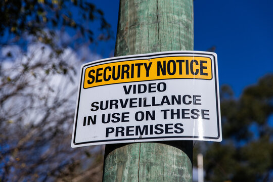 security notice sign on a post in full sun