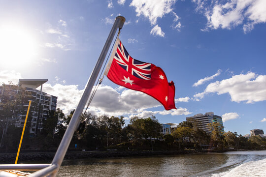 red ensign flag flying in the breeze on a sunny day