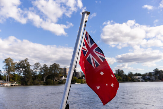 Australian Red Ensign on a flagpole on the back of a ferry