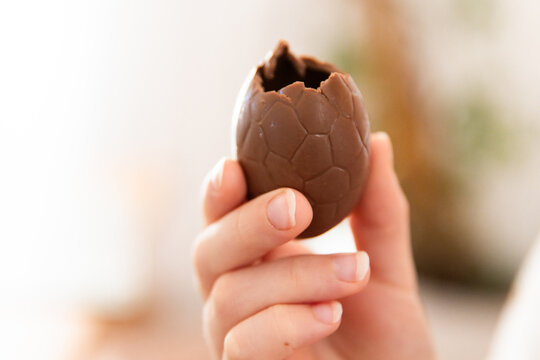a chocolate easter egg with a bite missing