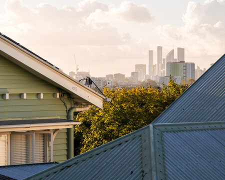 Brisbane city centre in the distance over the roofs of suburban houses