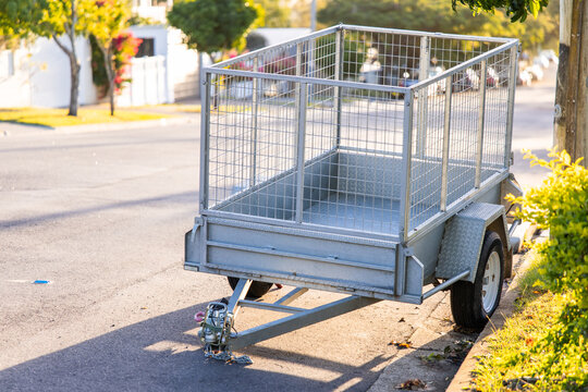 box trailer on the edge of a suburban street