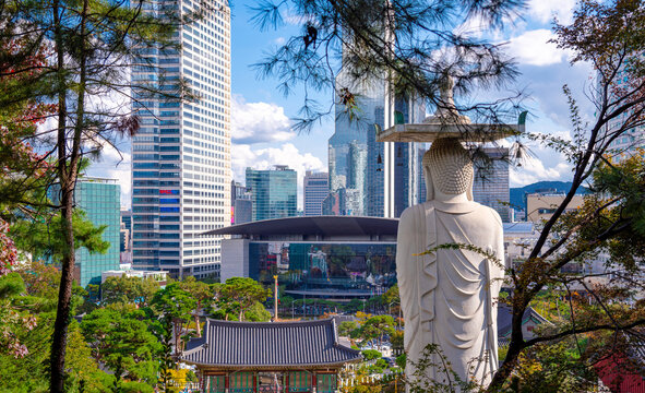 Maitreya Buddha and Bongeunsa Temple with Modern Seoul Skyline in Gangnam, Historic Buddhist Landmark and Popular Tourist Attraction in Seoul, South Korea