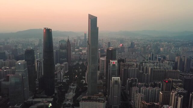 Aerial view of the Guangzhou skyline featuring the CTF Finance Centre surrounded by dense skyscrapers during golden hour in Guangzhou, Guangdong Province, China.