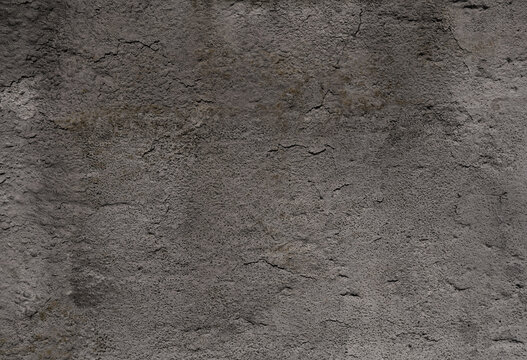 Plasterd concrete wall with carcks and peeling stucco.