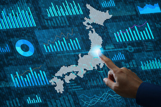 Marketing analytics using Japanese economic data and demographic statistics. Financial market graphs and charts on analytics dashboard. Businessperson touching map of Japan.