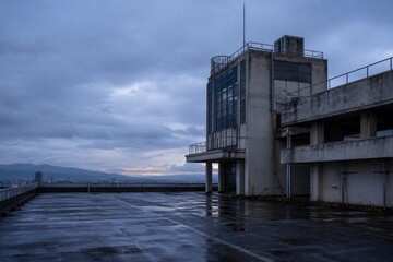 Obraz premium Rooftop of an abandoned Japanese office building after rain