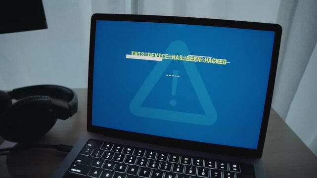 Hacker taking control over laptop displaying ransom message requesting payment to release blockage of personal private data and information. Cyber crime activity threat and risk to security in breach