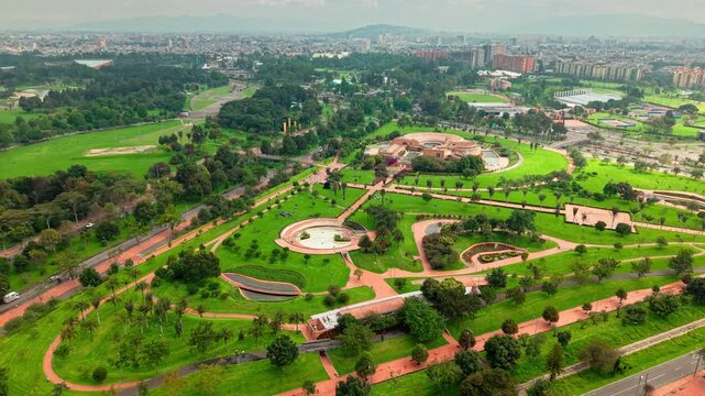 Aerial panorama of simon bolivar metropolitan park, lush green space with walking paths and recreational areas in colombian capital.