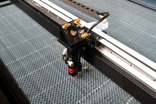 Laser cutting machine. The laser cuts the details. Automation and precision system. Modern industrial technology. Industrial laser engraving machine. Cnc laser head.