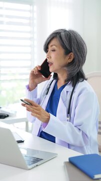 TeleMedicine, people and healthcare concept. Female doctor on phone calling  with patient.