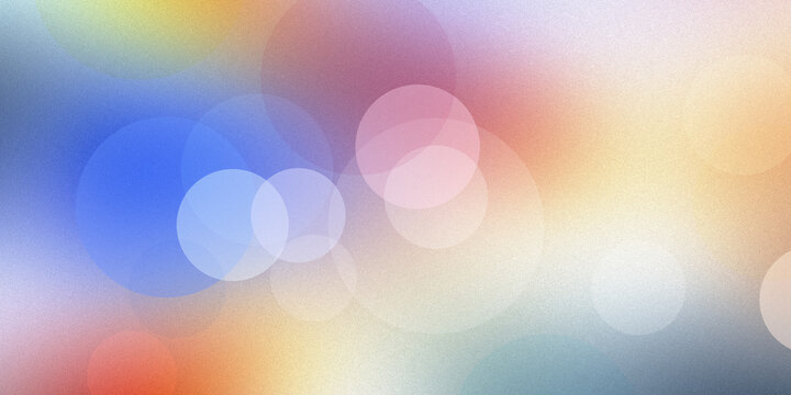 Abstract bokeh background featuring vibrant rainbow gradients and soft glowing orbs creates dreamy atmosphere for design.