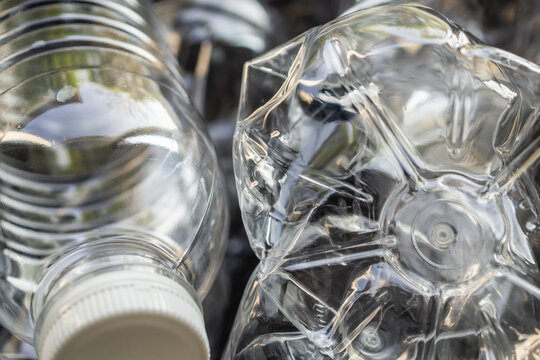 crushed plastic water bottles ready for recycling process, environmental pollution concept