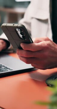 Hands, laptop and businessman scroll with phone for record keeping, finance app and auditing. Tech, accountant and website in office for financial reporting, budget review or MFA code to track income