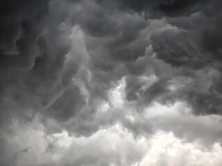 Dramatic Dark Storm Clouds Gathering in the Sky Before a Heavy Rainfall and Thunderstorm Event © Isnan Hafif