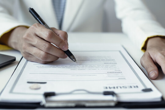 Businesswoman Reviewing Resumes for Recruitment and Hiring Candidates, Analyzing Applicant Information Before Job Interviews in Human Resources and Corporate Office