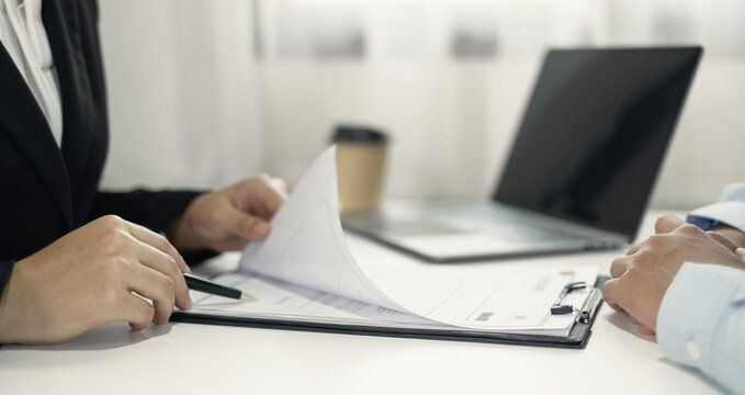 Business people hold a resume and talk to job applicants for job interviews about careers and Their personal history in the company. Recruitment concepts