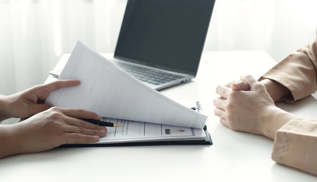 Business people hold a resume and talk to job applicants for job interviews about careers and Their personal history in the company. Recruitment concepts