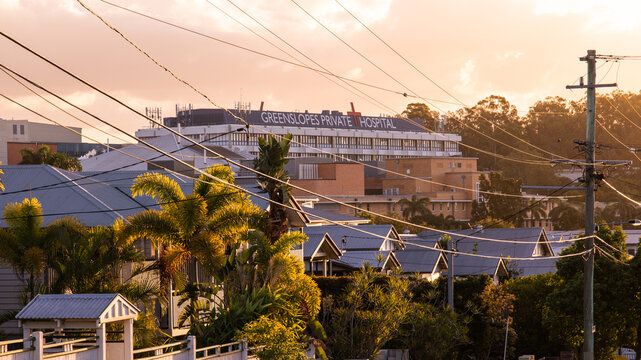 Greenslopes Private Hospital seen over the rooftops of nearby houses