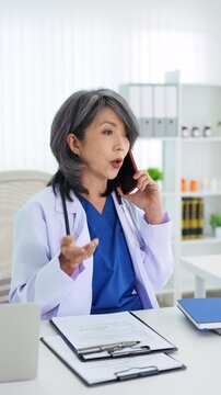 TeleMedicine, people and healthcare concept. Female doctor on phone calling  with patient.
