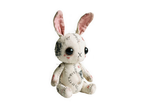 Creepy handmade voodoo rabbit doll with button eyes isolated on transparent background