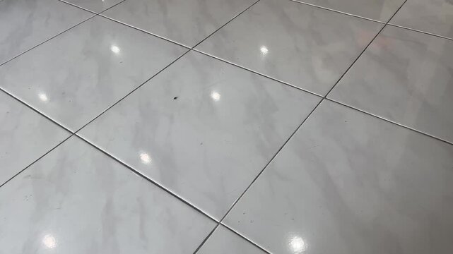 Clean Ceramic Tile Floor with Reflection of Light